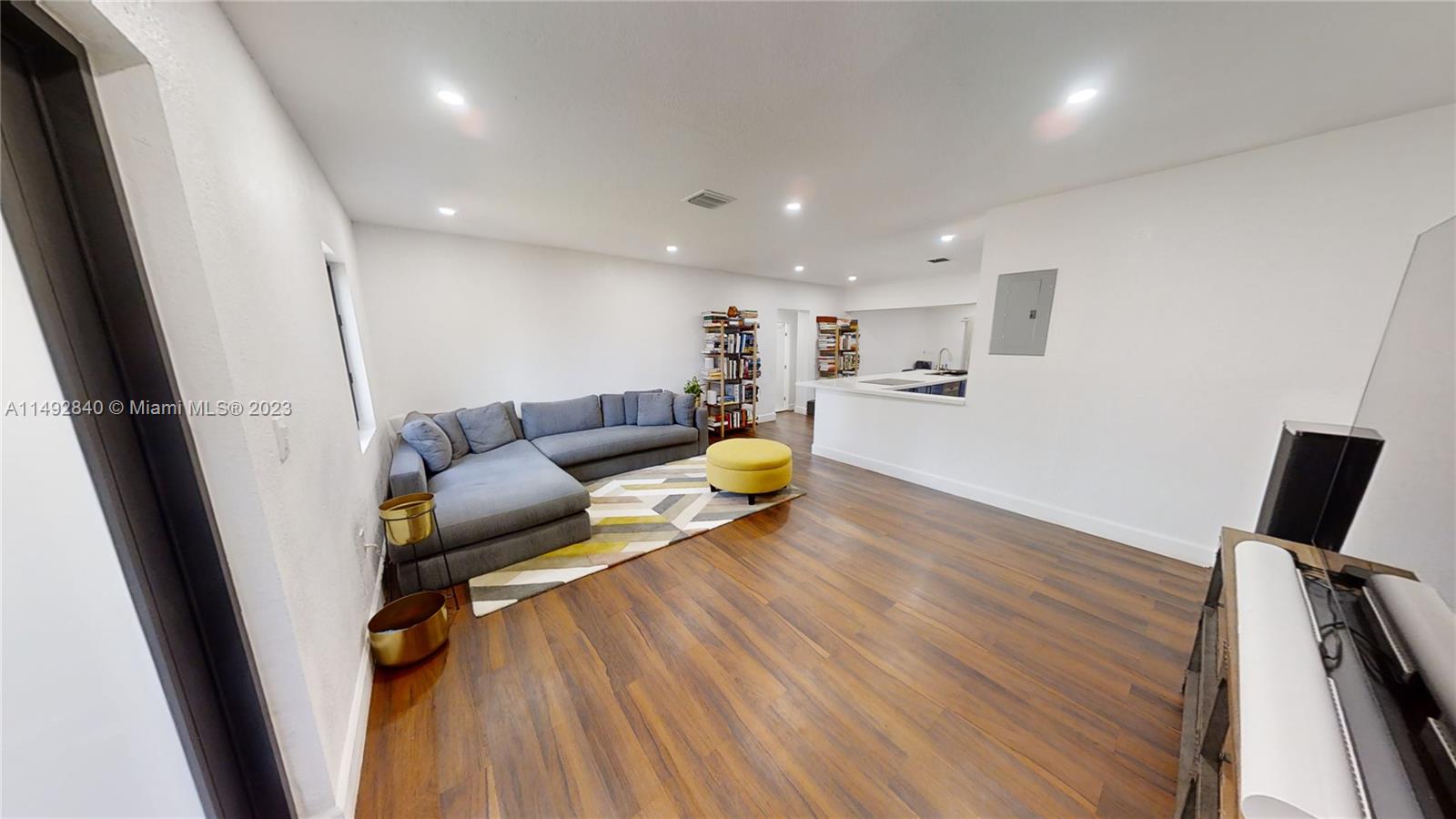 445 Southwest 62nd Court Miami, FL 33144 - Photo 6 of 49 a living room with furniture and a wooden floor