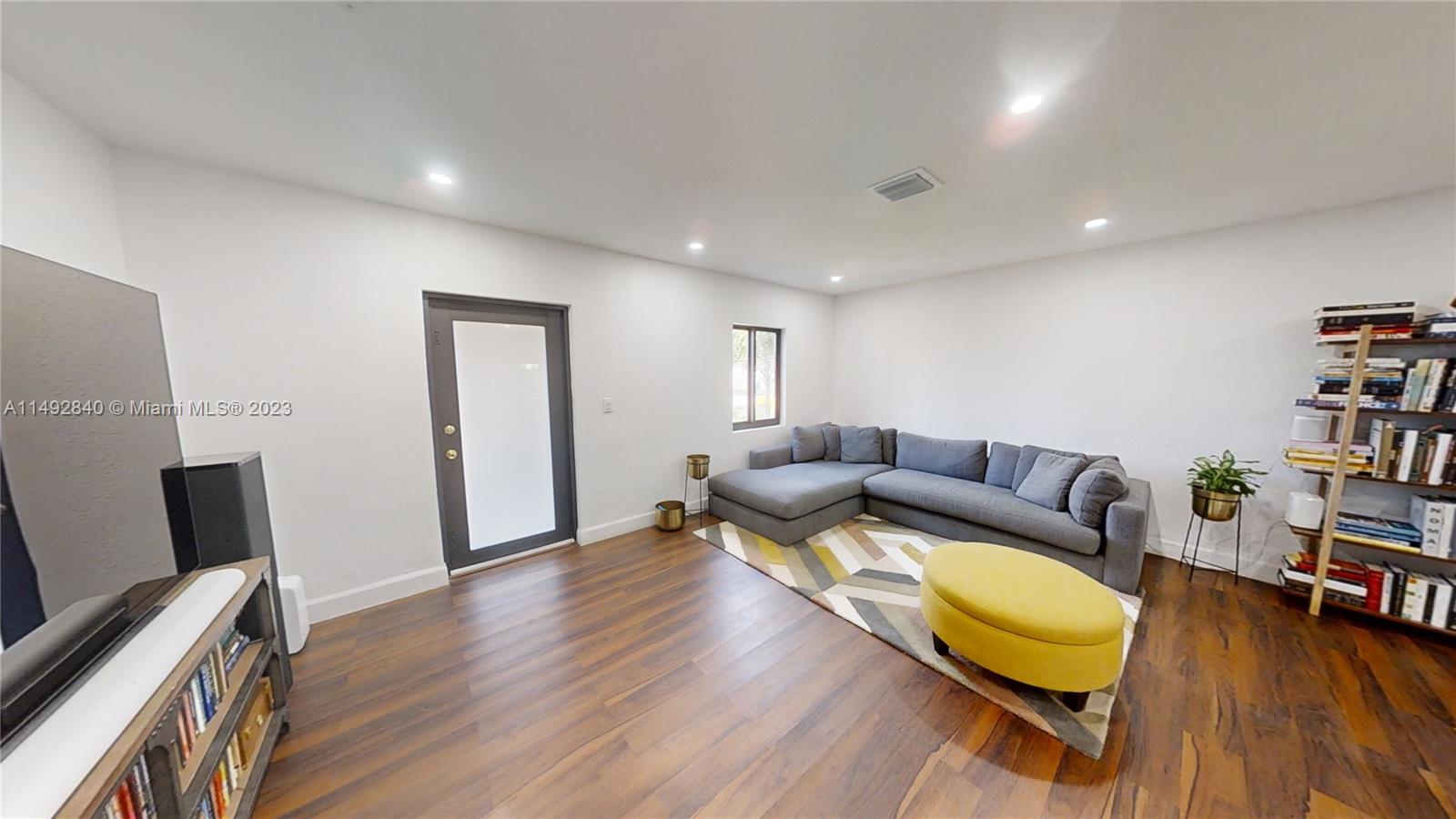 445 Southwest 62nd Court Miami, FL 33144 - Photo 7 of 49 a living room with furniture and a wooden floor