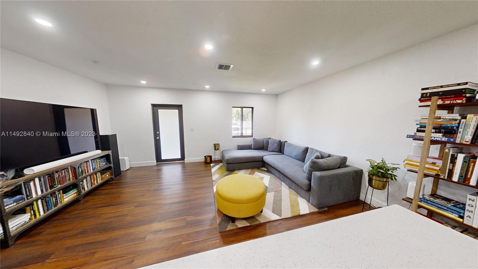 445 Southwest 62nd Court Miami, FL 33144 - Photo 8 of 49 a living room with furniture and a wooden floor
