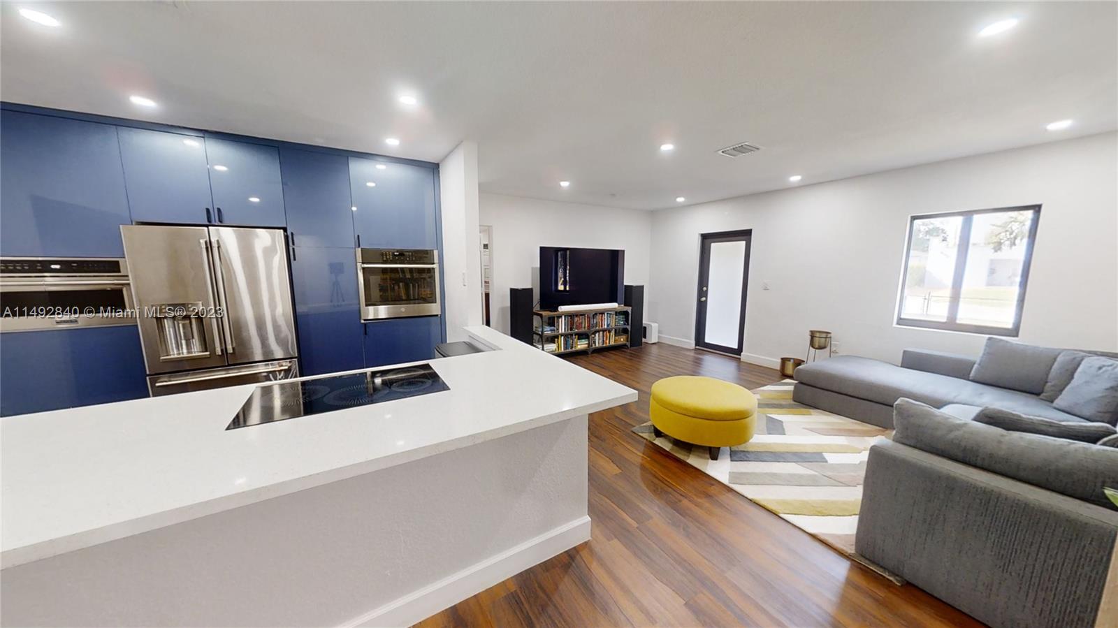 445 Southwest 62nd Court Miami, FL 33144 - Photo 9 of 49 a living room with stainless steel appliances furniture fireplace and flat screen tv