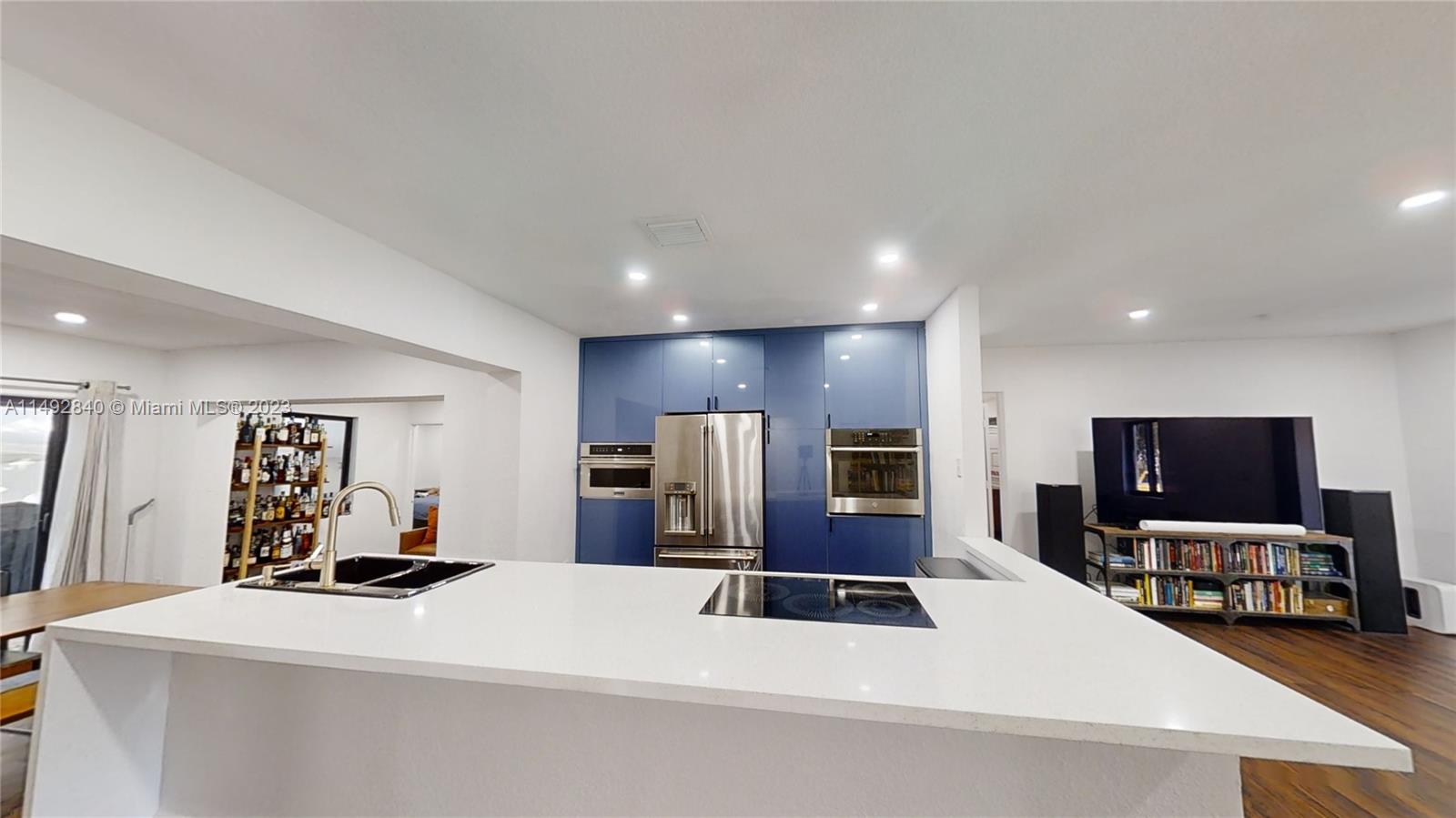 445 Southwest 62nd Court Miami, FL 33144 - Photo 10 of 49 a large white kitchen with stainless steel appliances a large counter top