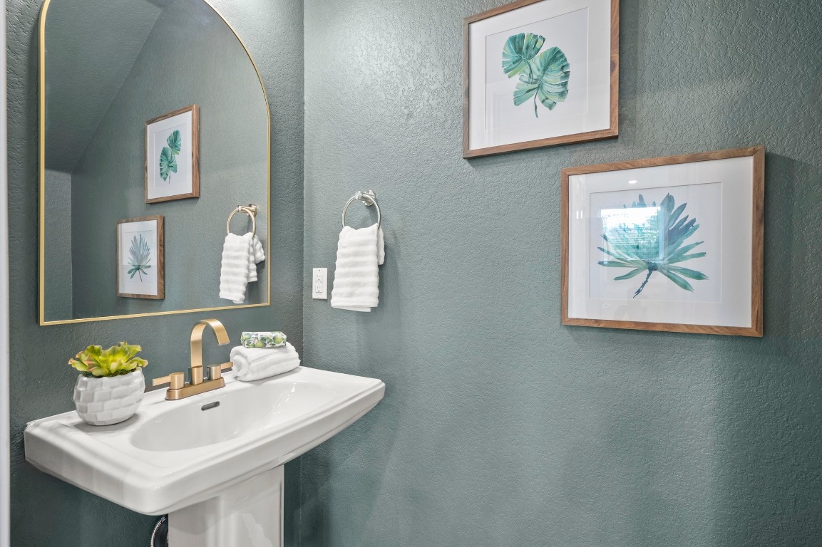 9015 Cattle Baron Path, Unit 2005 Austin, TX 78747 - Photo 13 of 37 a bathroom with a sink and a mirror