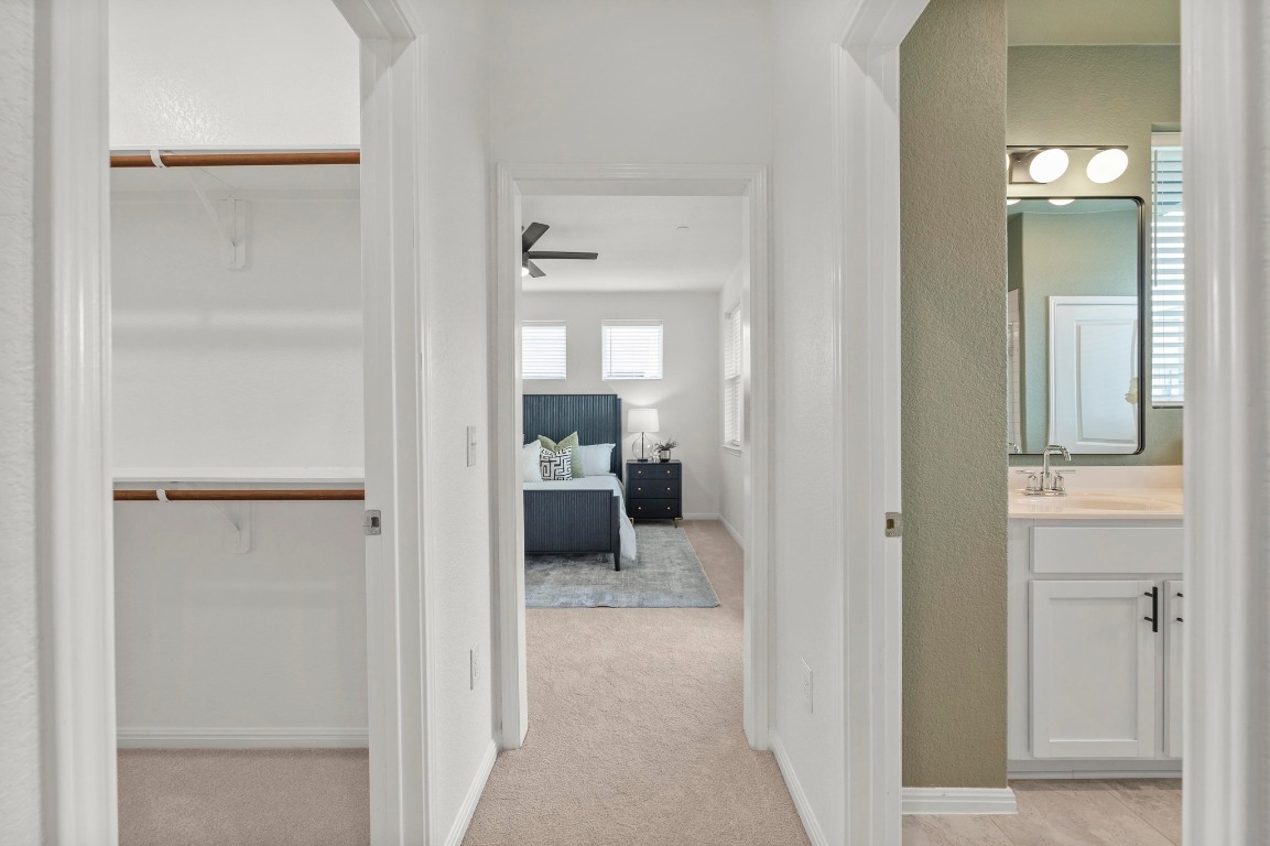 9015 Cattle Baron Path, Unit 2005 Austin, TX 78747 - Photo 14 of 37 a en suite bathroom with a toilet sink