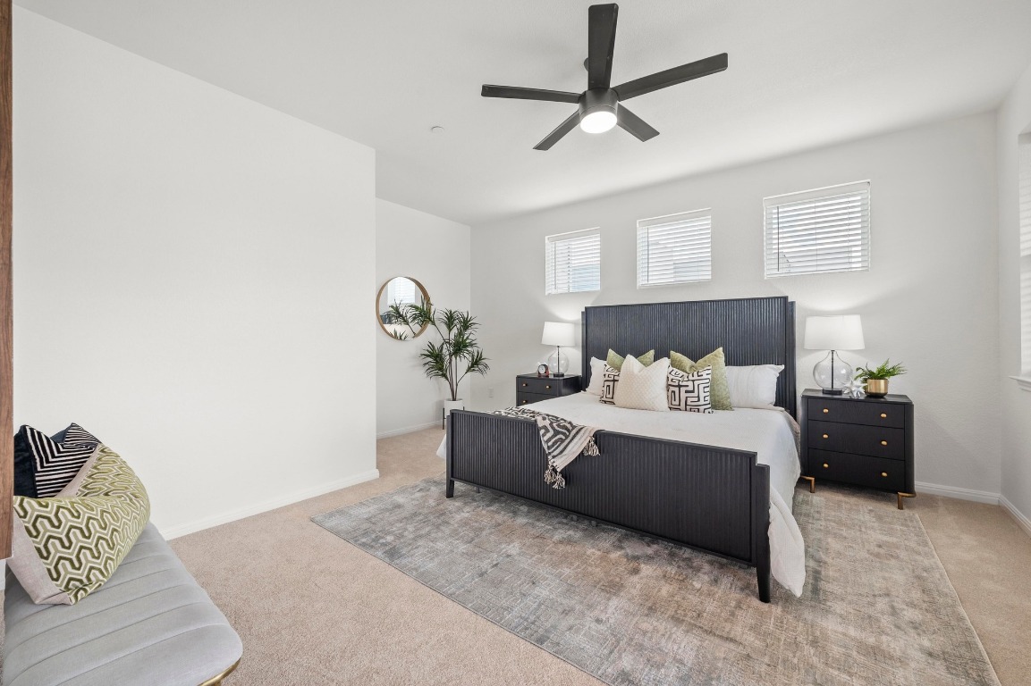 9015 Cattle Baron Path, Unit 2005 Austin, TX 78747 - Photo 17 of 37 a bed room with a bed and a couch