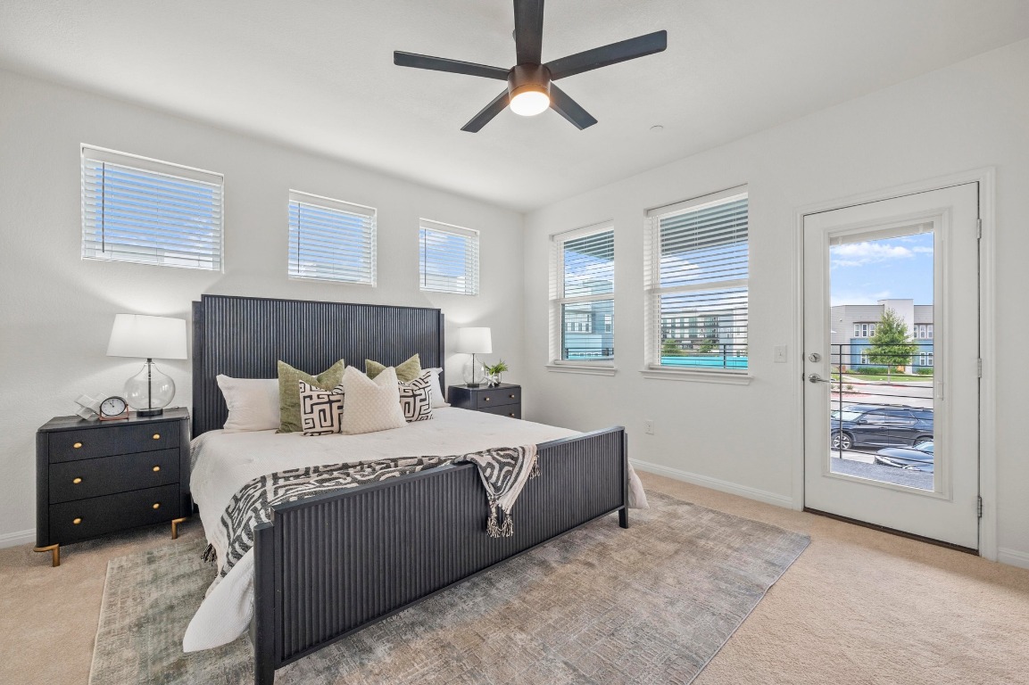 9015 Cattle Baron Path, Unit 2005 Austin, TX 78747 - Photo 19 of 37 a bedroom with a large bed and a window