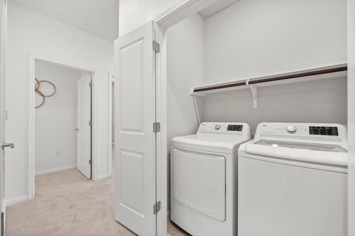 9015 Cattle Baron Path, Unit 2005 Austin, TX 78747 - Photo 25 of 37 a view of storage and utility room with washer and dryer
