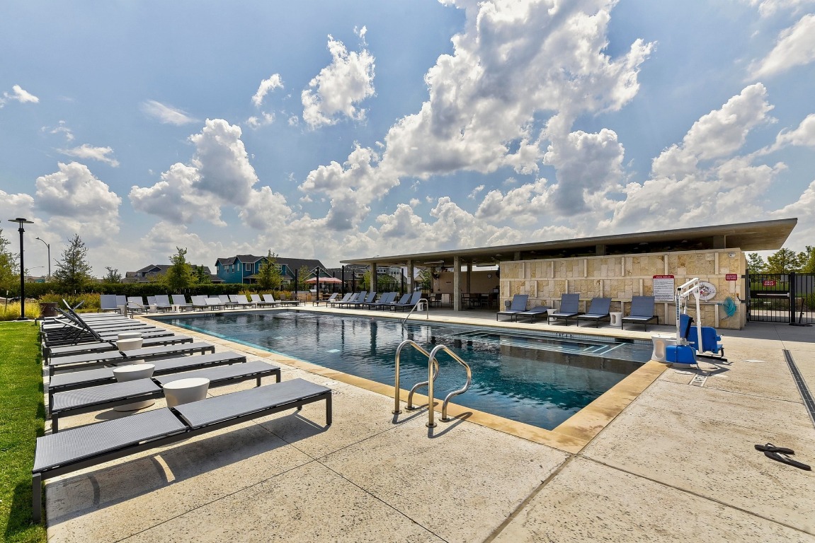 9015 Cattle Baron Path, Unit 2005 Austin, TX 78747 - Photo 31 of 37 a view of a swimming pool with lounge chair