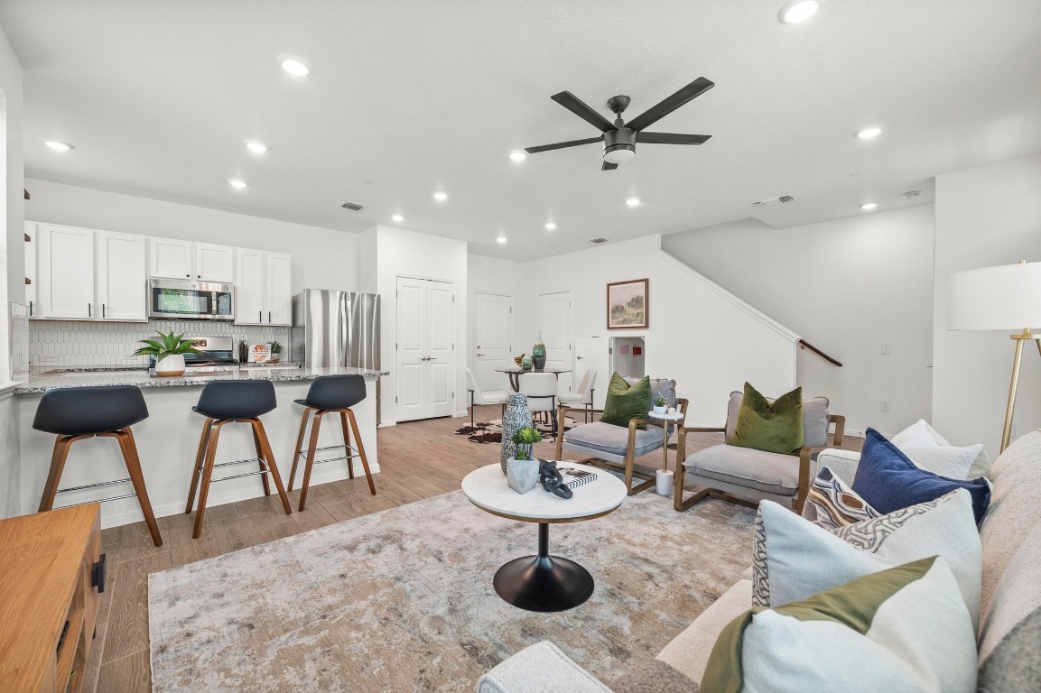 9015 Cattle Baron Path, Unit 2005 Austin, TX 78747 - Photo 4 of 37 a kitchen with a dining table and chairs