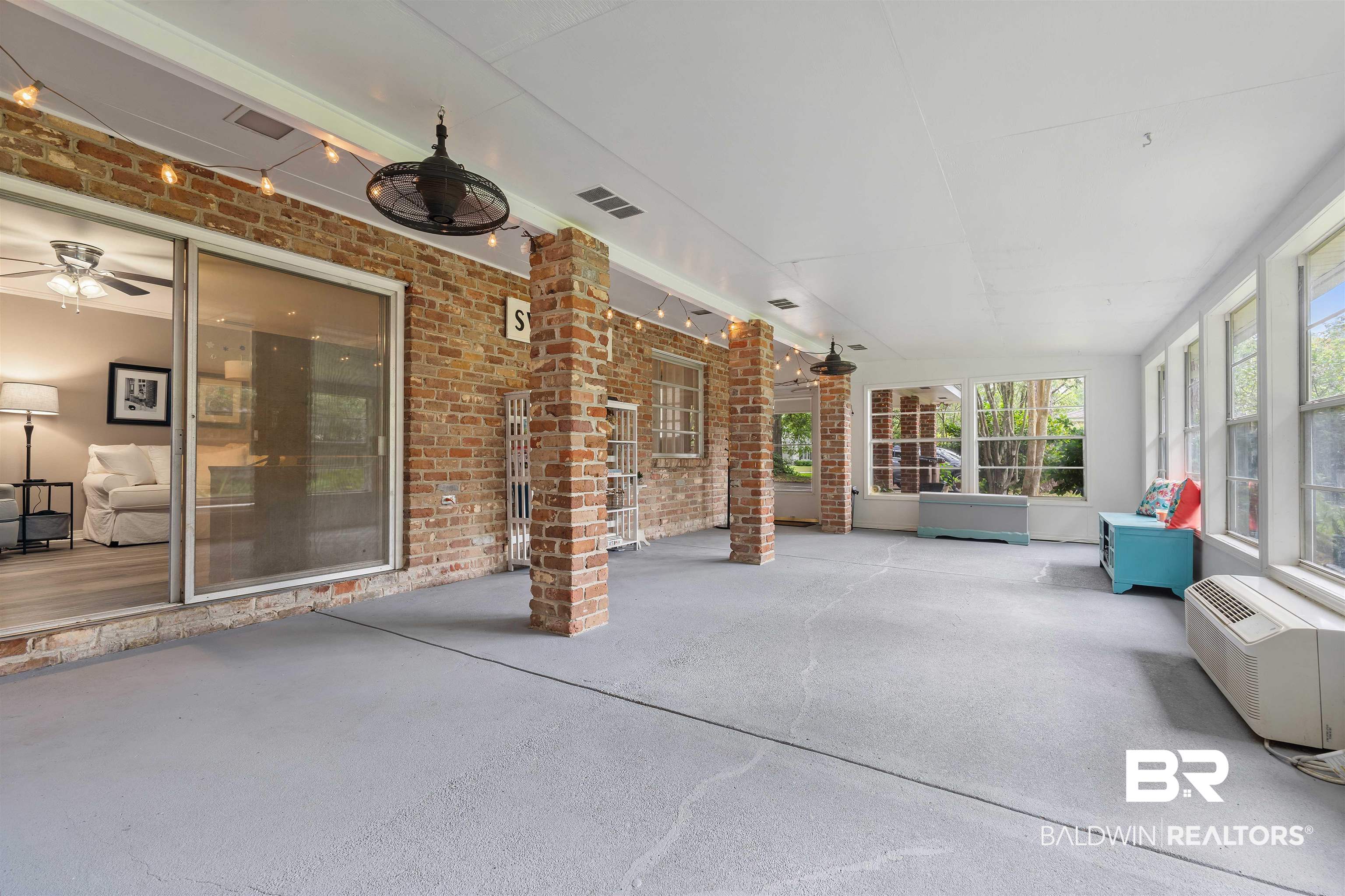4051 East Canal Circle Mobile, AL 36619 - Photo 29 of 32 Unfurnished sunroom featuring ceiling fan