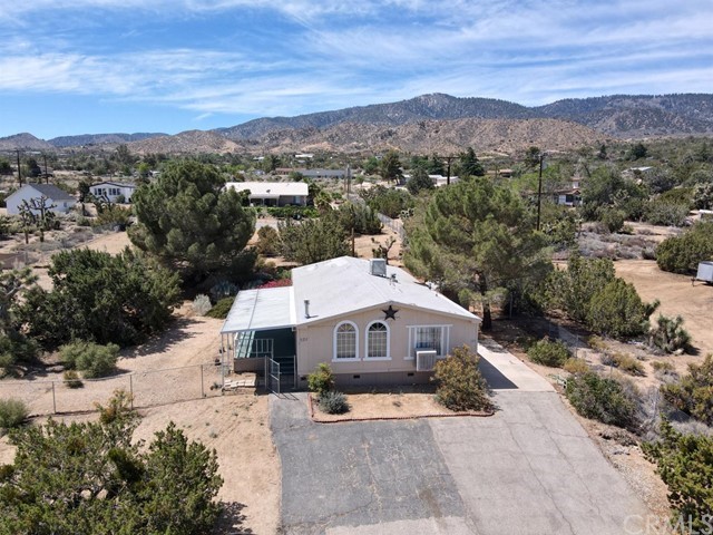 627 Glenview Road Pinon Hills, CA 92372 - Photo 1 of 1 a front view of a house with a yard
