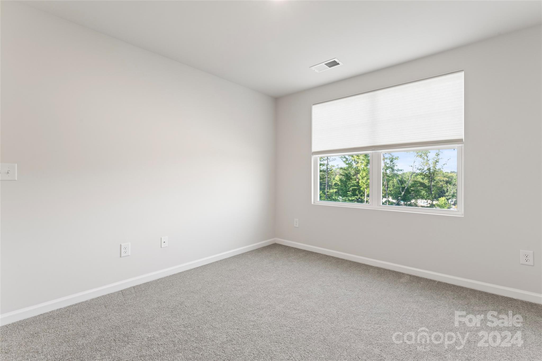 1655 Corwin Bend Road Tega Cay, SC 29708 - Photo 23 of 41 an empty room with a window
