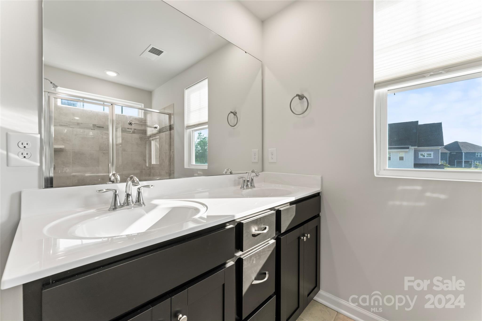 1655 Corwin Bend Road Tega Cay, SC 29708 - Photo 28 of 41 a bathroom with a sink double vanity and a mirror