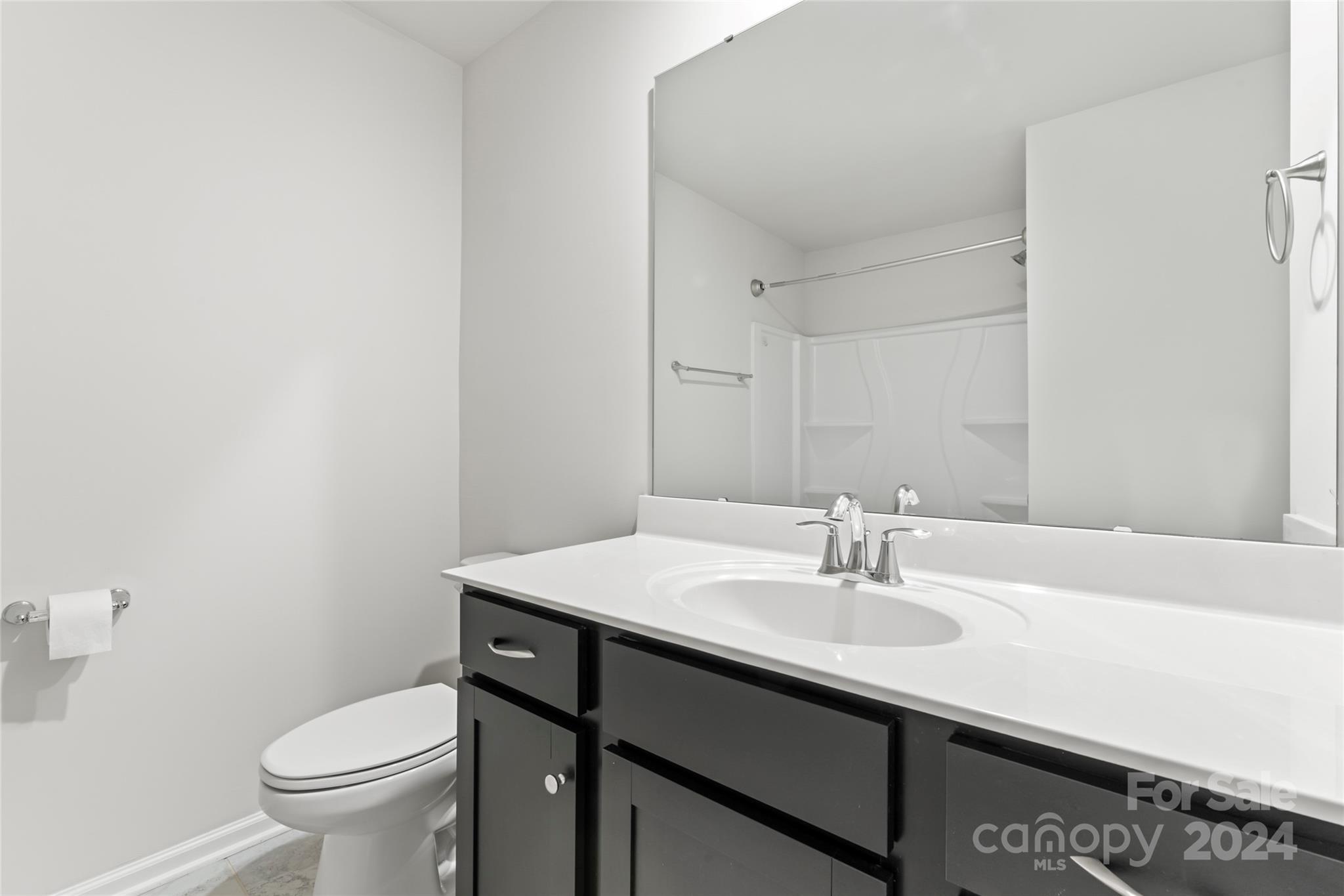 1655 Corwin Bend Road Tega Cay, SC 29708 - Photo 29 of 41 a bathroom with a sink toilet and a mirror