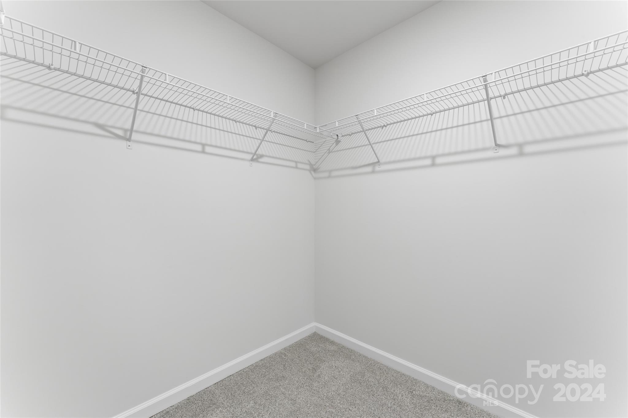 1655 Corwin Bend Road Tega Cay, SC 29708 - Photo 32 of 41 a view of a room with racks on the wall