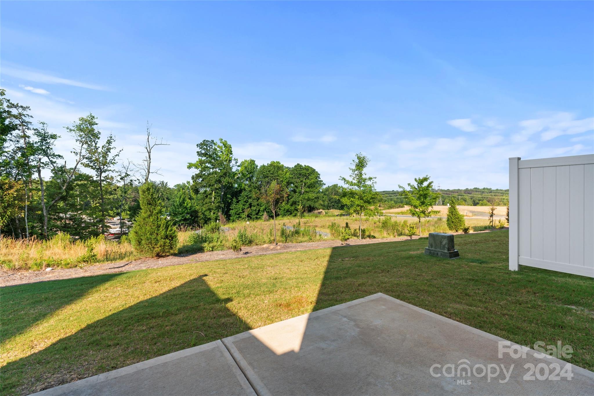 1655 Corwin Bend Road Tega Cay, SC 29708 - Photo 40 of 41 a view of a swimming pool with an outdoor space and seating area