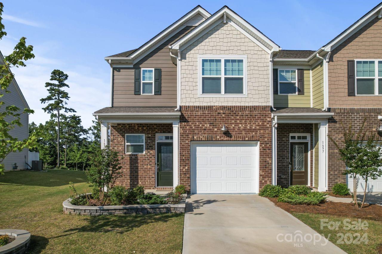 1655 Corwin Bend Road Tega Cay, SC 29708 - Photo 4 of 41 a front view of a house with a yard