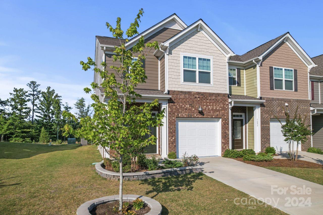 1655 Corwin Bend Road Tega Cay, SC 29708 - Photo 5 of 41 a front view of a house with a yard and garage