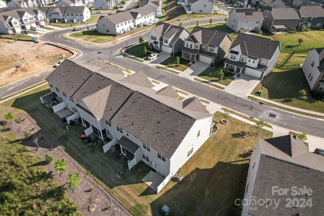 1655 Corwin Bend Road Tega Cay, SC 29708 - Photo 8 of 41 an aerial view of a residential apartment building with a yard