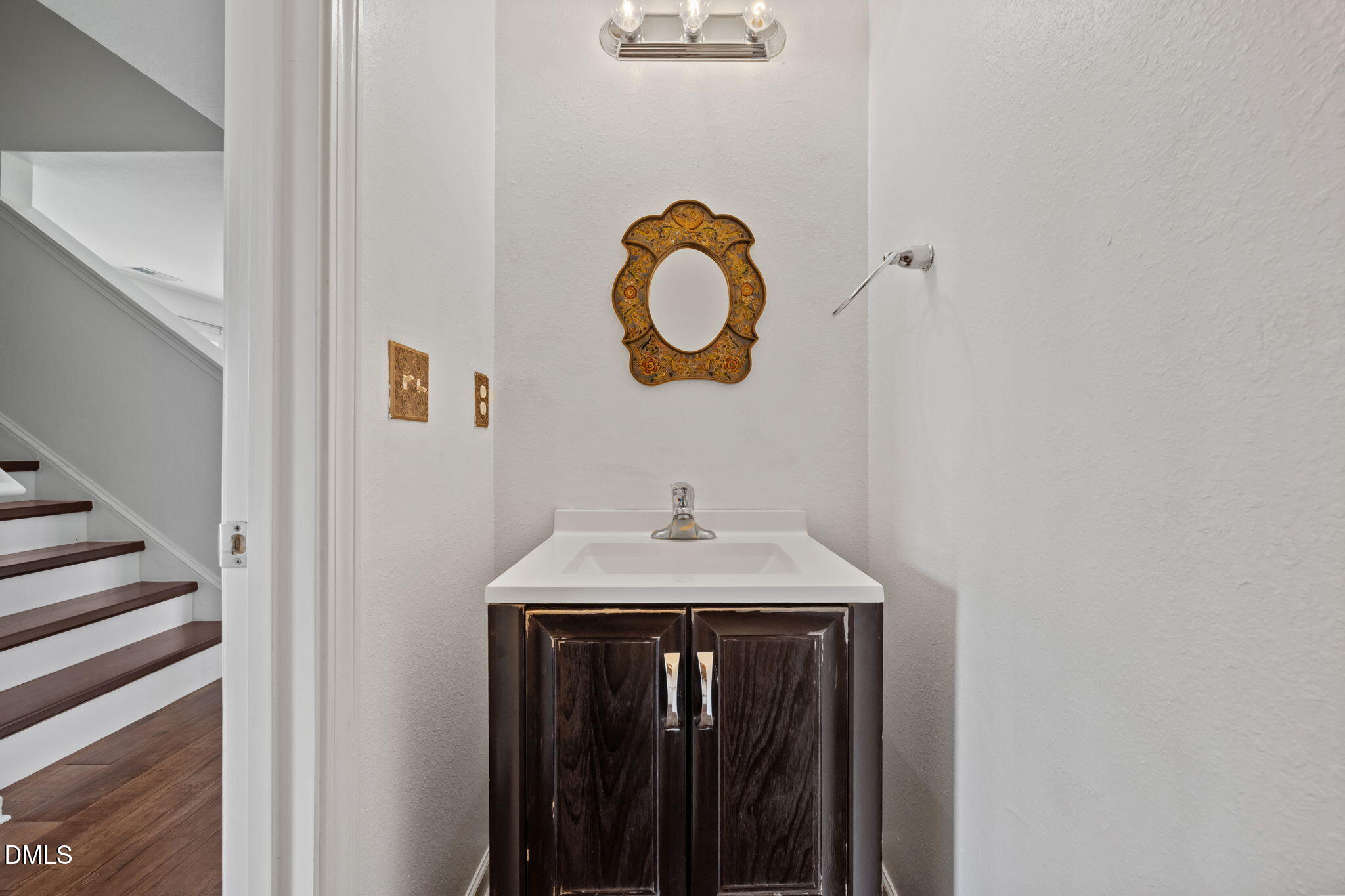 239 Battery Way Bunnlevel, NC 28323 - Photo 17 of 47 a bathroom with a sink and a mirror
