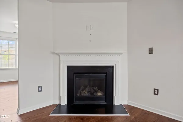a living room with a fireplace