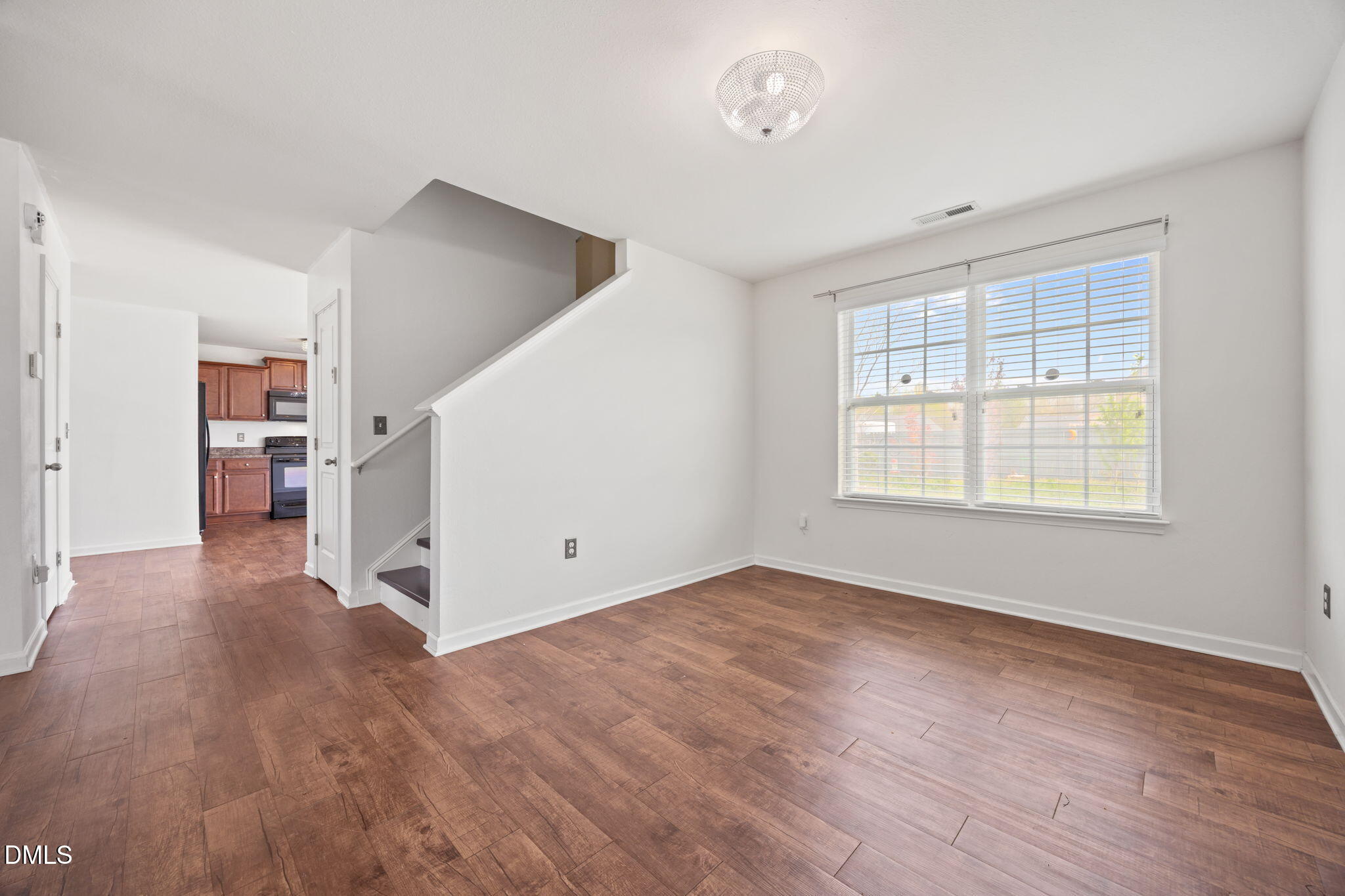 239 Battery Way Bunnlevel, NC 28323 - Photo 22 of 47 an empty room with wooden floor and windows