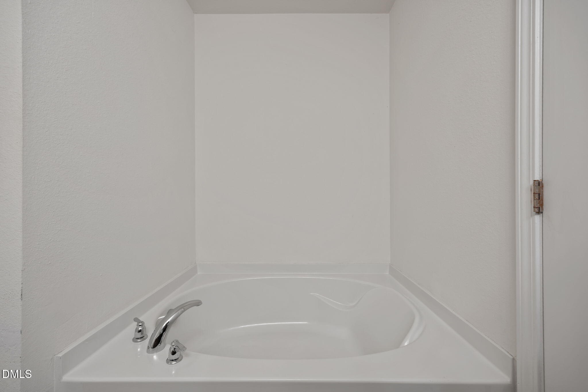 239 Battery Way Bunnlevel, NC 28323 - Photo 28 of 47 a white bath tub sitting next to a white sink and vanity
