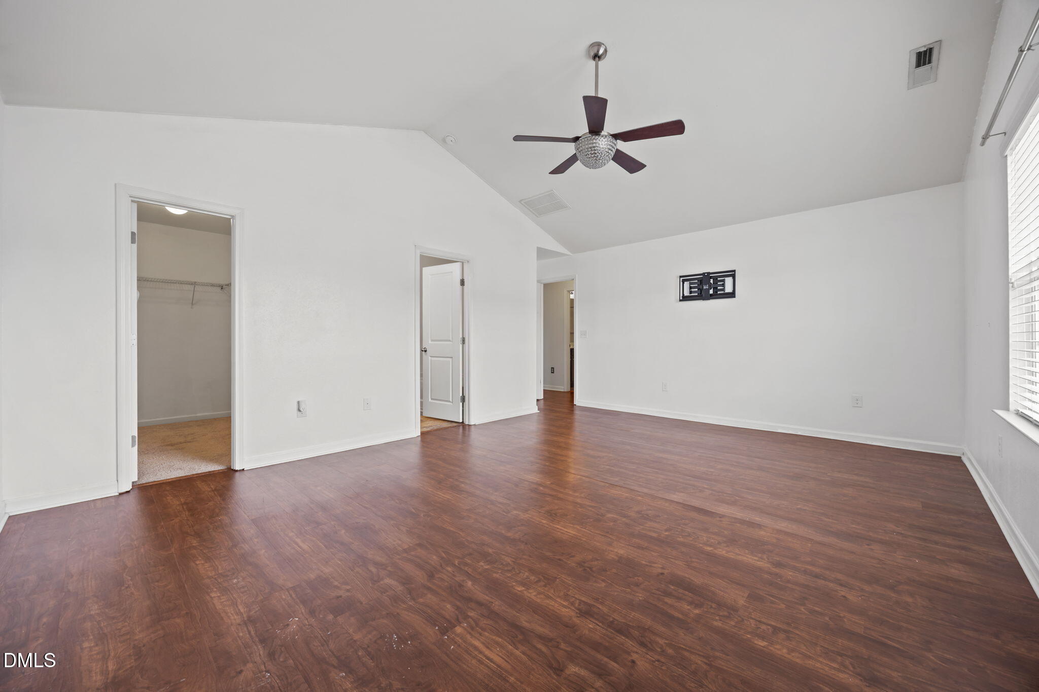 239 Battery Way Bunnlevel, NC 28323 - Photo 32 of 47 a view of a room with wooden floor and ceiling fan