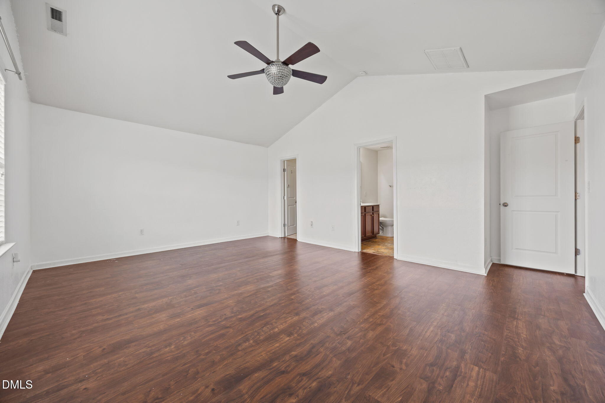 239 Battery Way Bunnlevel, NC 28323 - Photo 33 of 47 a view of an empty room with wooden floor and a ceiling fan
