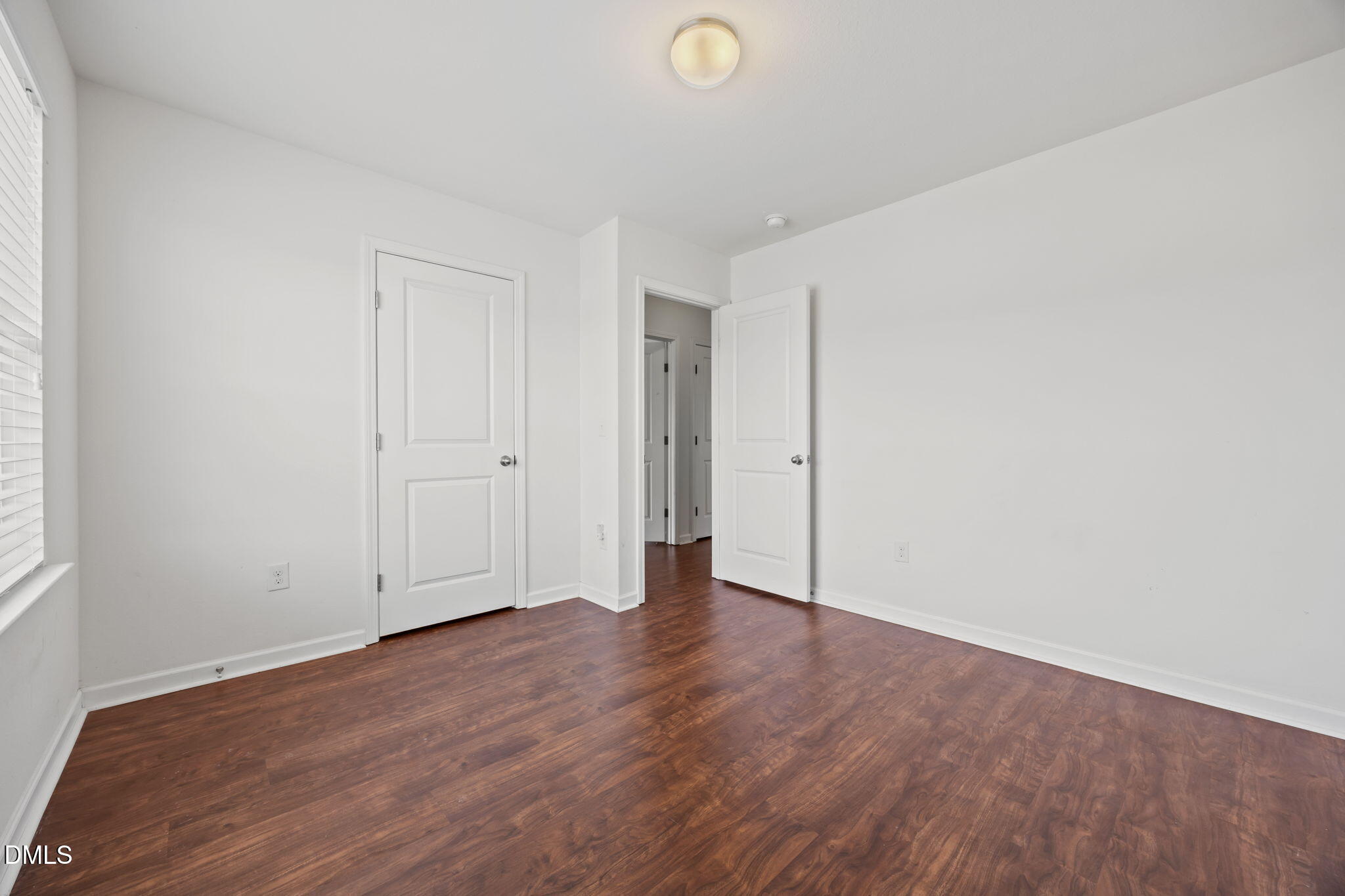 239 Battery Way Bunnlevel, NC 28323 - Photo 34 of 47 a view of an empty room with wooden floor