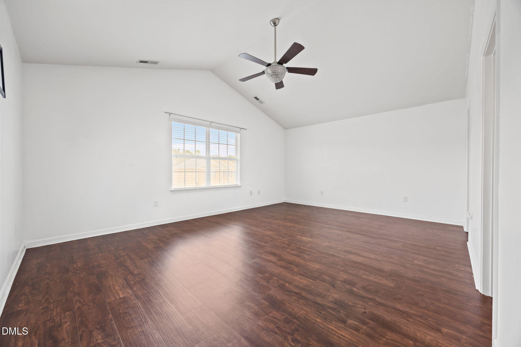 239 Battery Way Bunnlevel, NC 28323 - Photo 35 of 47 an empty room with wooden floor ceiling fan and windows