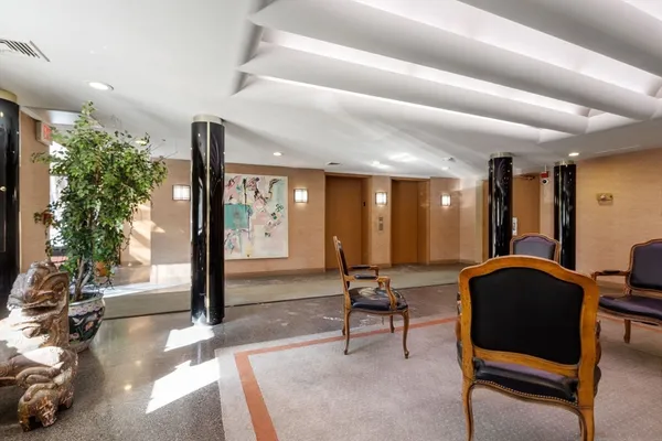 a kitchen with a refrigerator and a sink