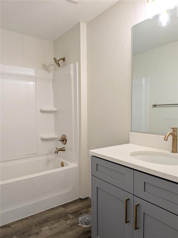 7217 Hemlock Loop Ocala, FL 34472 - Photo 11 of 36 a bathroom with a sink and a bathtub