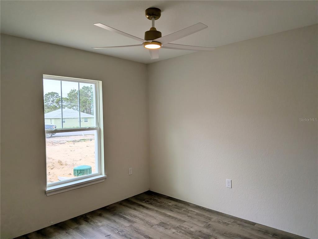 7217 Hemlock Loop Ocala, FL 34472 - Photo 12 of 36 an empty room with a window