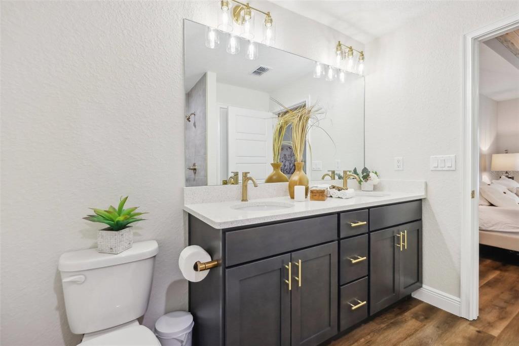 7217 Hemlock Loop Ocala, FL 34472 - Photo 13 of 27 a bathroom with a sink vanity and a toilet