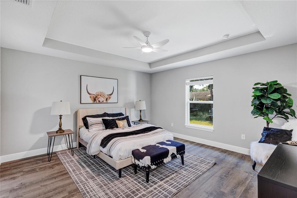 7217 Hemlock Loop Ocala, FL 34472 - Photo 20 of 36 a bedroom with bed and a window