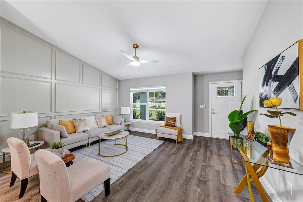 7217 Hemlock Loop Ocala, FL 34472 - Photo 23 of 27 a living room with furniture and wooden floor