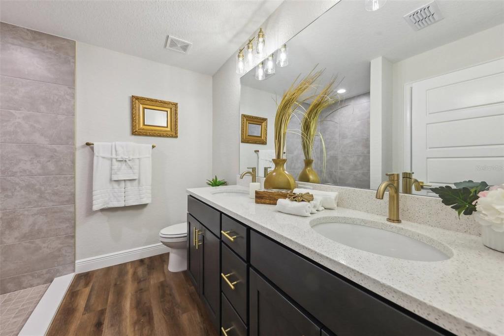 7217 Hemlock Loop Ocala, FL 34472 - Photo 23 of 36 a bathroom with a sink and a mirror