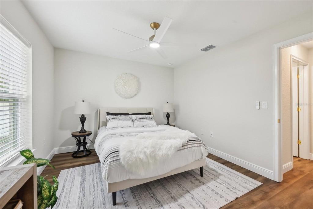 7217 Hemlock Loop Ocala, FL 34472 - Photo 27 of 36 a bedroom with a bed and a window