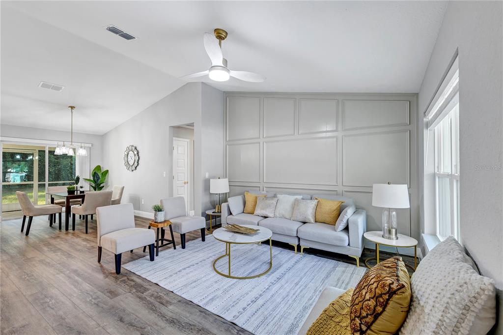 7217 Hemlock Loop Ocala, FL 34472 - Photo 31 of 36 a living room with furniture and wooden floor