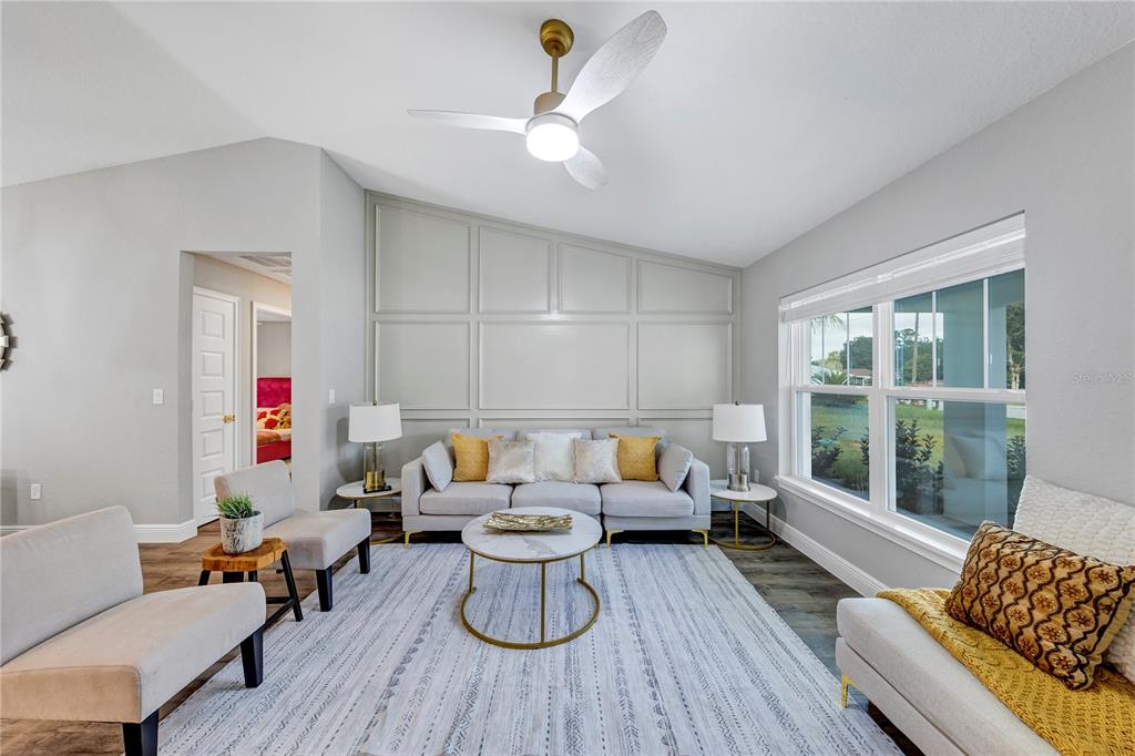 7217 Hemlock Loop Ocala, FL 34472 - Photo 33 of 36 a living room with furniture and a large window