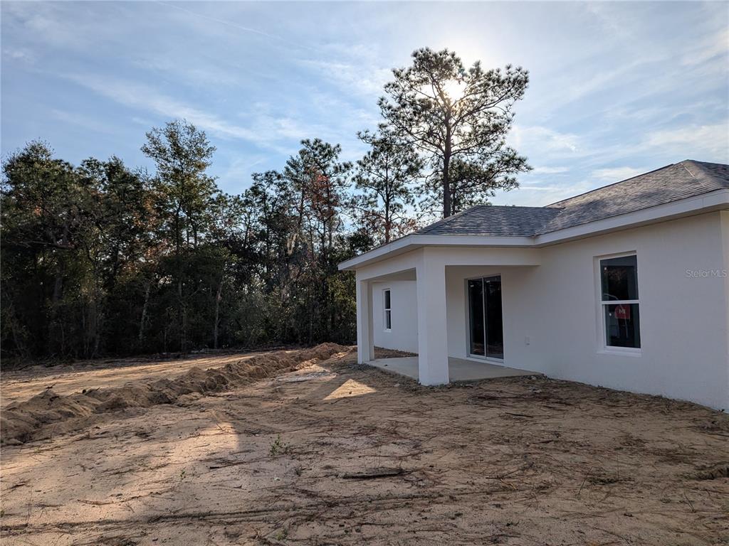 7217 Hemlock Loop Ocala, FL 34472 - Photo 5 of 27 a view of a house with a yard
