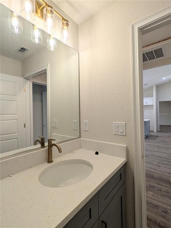 7217 Hemlock Loop Ocala, FL 34472 - Photo 9 of 36 a bathroom with a sink and a mirror