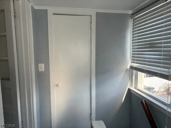 a view of walk in closet with window