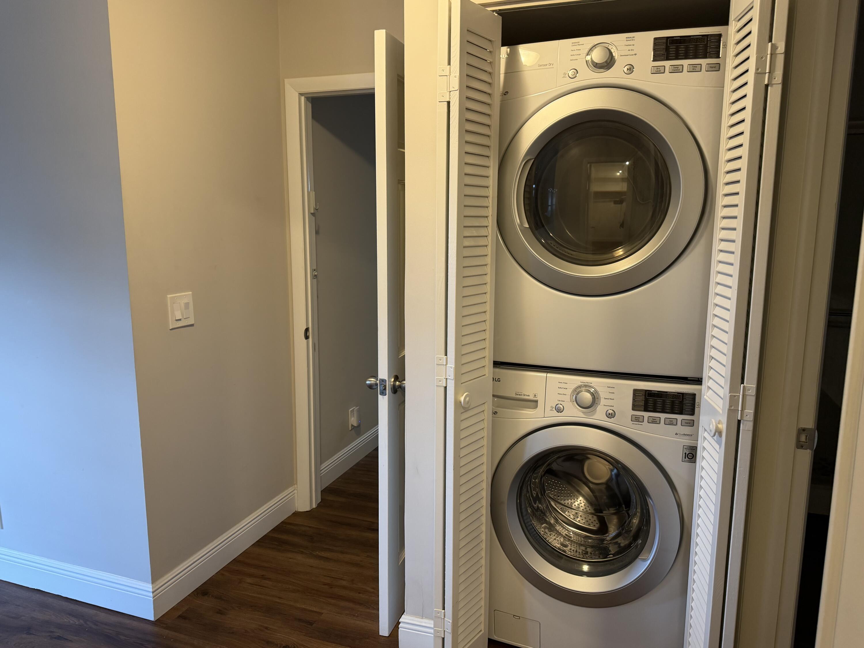 340 Orange Tree Drive, Unit 1 Atlantis, FL 33462 - Photo 16 of 23 a view of a hallway with washer and dryer