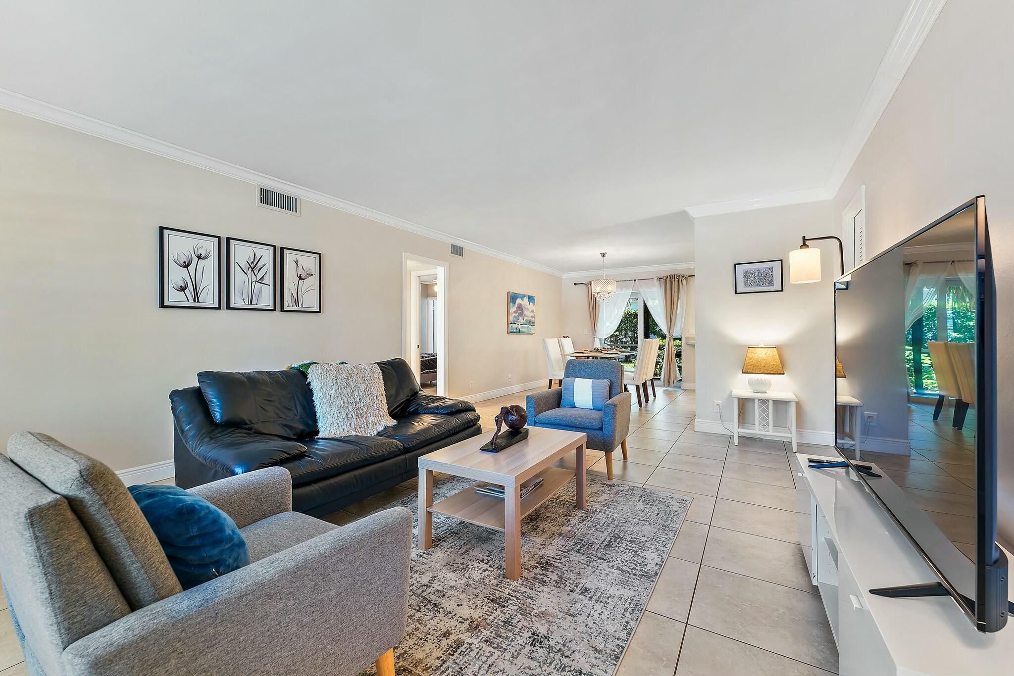 3036 Park Avenue Riviera Beach, FL 33404 - Photo 1 of 22 a living room with furniture and a rug