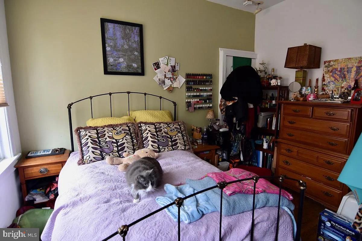 211 South 45th Street Philadelphia, PA 19104 - Photo 4 of 6 a bedroom with a bed and wooden floor