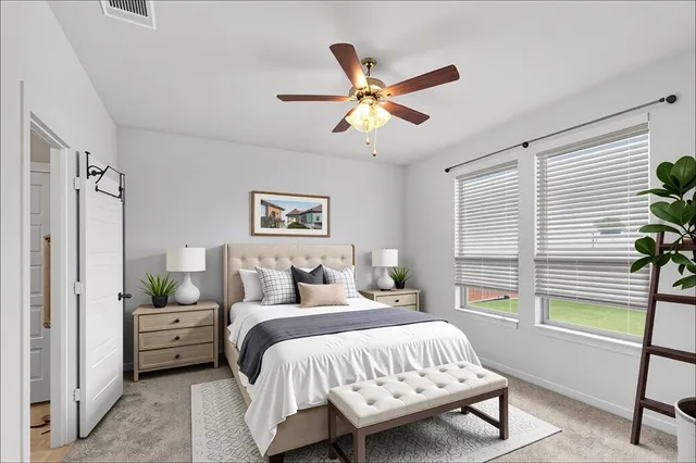 a bedroom with a bed a chandelier and a window