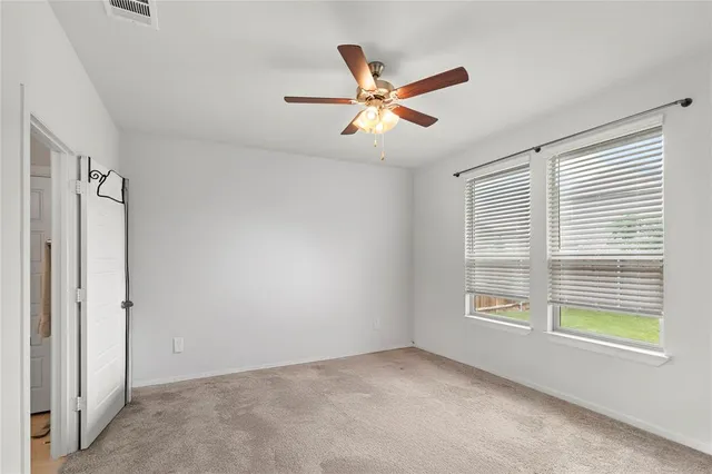 a view of empty room with windows