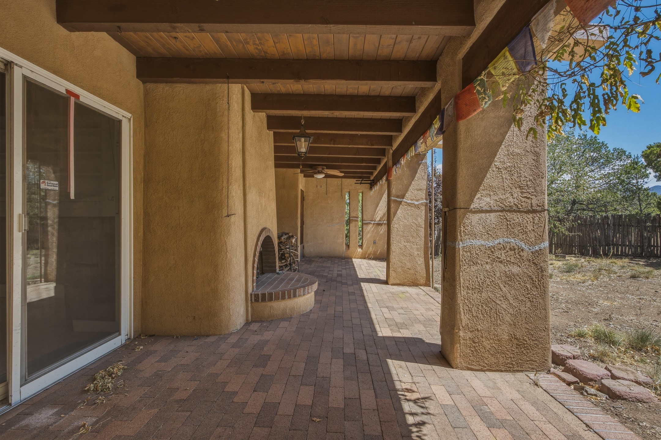 136 Ridgecrest Drive Santa Fe, NM 87505 - Photo 18 of 33 East-facing portal off of kitchen and secondary living area