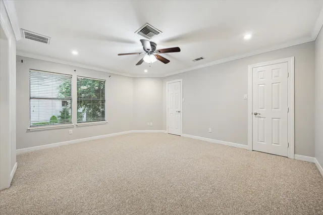 a bathroom with a granite countertop double vanity sink and mirror